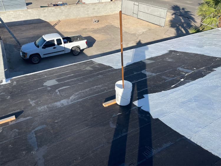Commercial roof repair Tucson hero image Universal Roofing crew performing commercial roof repair in Tucson