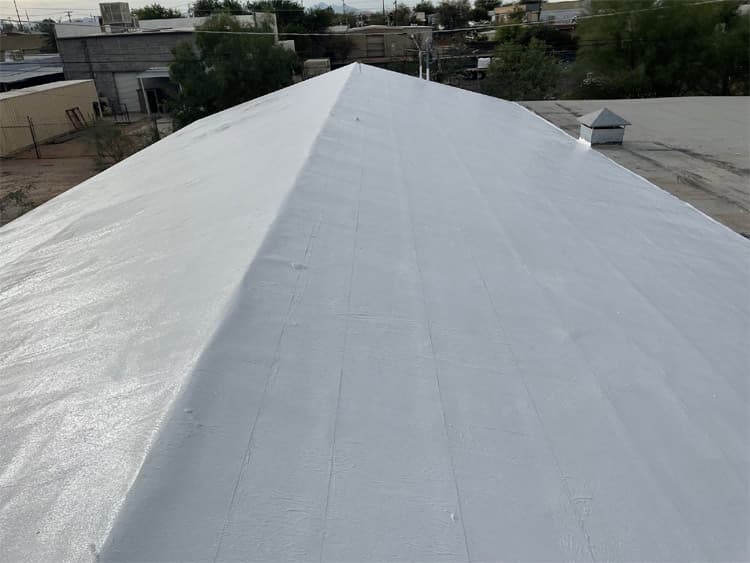 Commercial roof replacement Tucson hero image Universal Roofing crew performing commercial roof replacement in Tucson