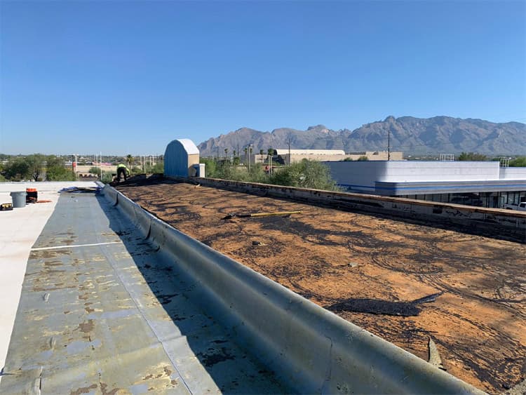 Tpo roofing Tucson hero image Universal Roofing crew performing TPO roofing in Tucson